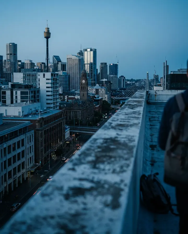 A city skyline at blue hour seen from a rooftop, a frame from a faceless YouTube video